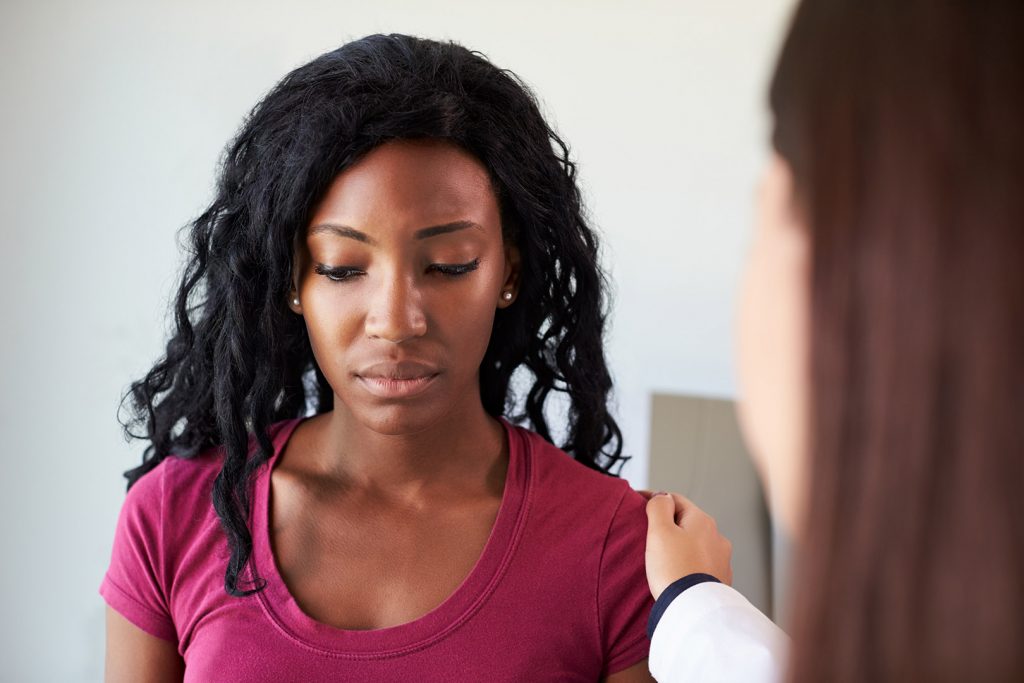 Woman Talking to Doctor