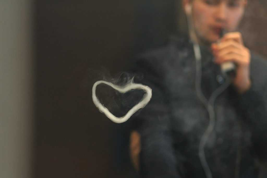 Cool Vaper Dude Blowing Smoke Rings in the Shape of Heart Even As He Damages His Own